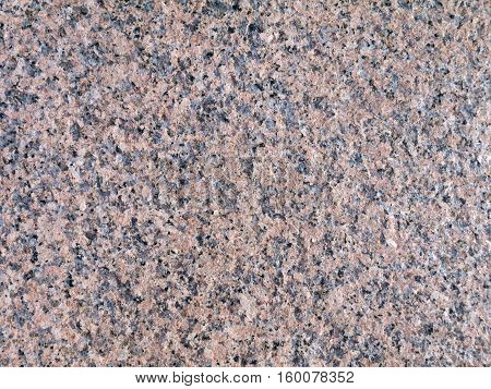 Pink gray granite rock closeup texture background
