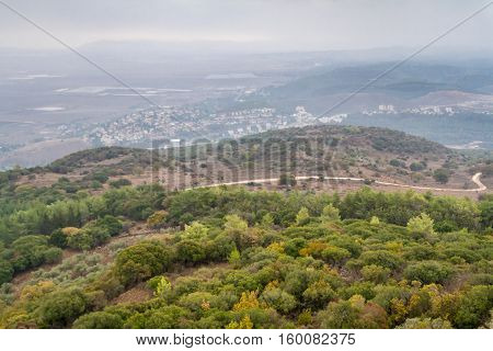 View of the Jezreel Valley in fog in winter cloudy day from Muhraqa on Mount Carmel in Lower Galilee Israel