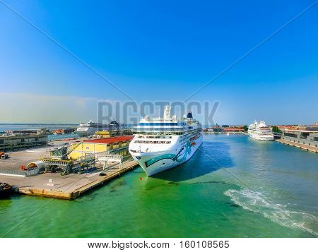 Venice, Italy - June 06, 2015: Cruise Ship Norwegian Jade by NCL docked at the port of Venice, Italy on a background of the roofs on June 06, 2015