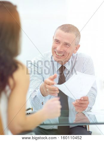 boss discusses with the assistant business documents in the offi