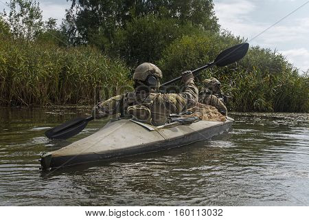 Special forces operators in the military kayak