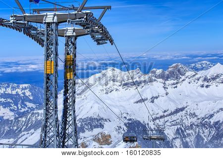 Mt. Titlis, Switzerland - 9 March, 2016: the Ice Flyer chair lift. Mount Titlis is a mountain of the Uri Alps, located on the border between the Swiss Cantons of Obwalden and Bern, mainly accessed from the town of Engelberg on the north side.