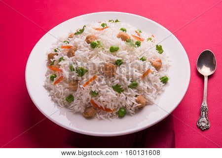 Yummy soya pulao or pilav or pulav or rice or soyabean chunk fried rice with peas and beans, indian or pakistani cuisine