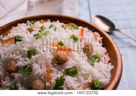 Yummy soya pulao or pilav or pulav or rice or soyabean chunk fried rice with peas and beans, indian or pakistani cuisine