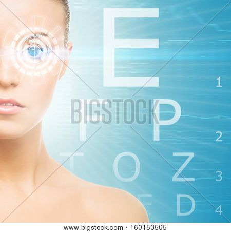 Beautiful woman with laser hologram and test vision table over cyan background.