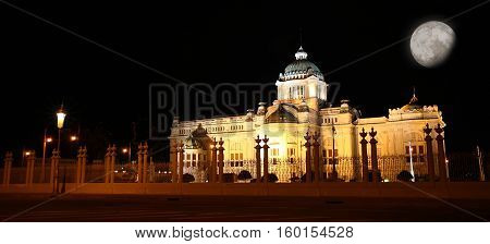 beautiful landscape Ananta Samakhom Throne Hall Royal Palace at night with full moon and copy space for text