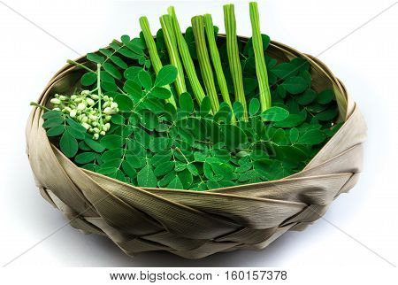 Moringa leaf and drumstick in a natural bowl