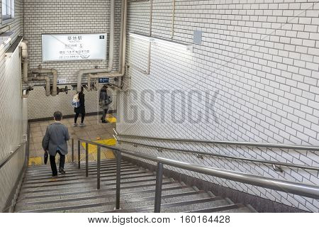 Tokyo, Japan - NOV 18, 2016 : Passengers walking down stairs for train the gate in the Tsukiji Station