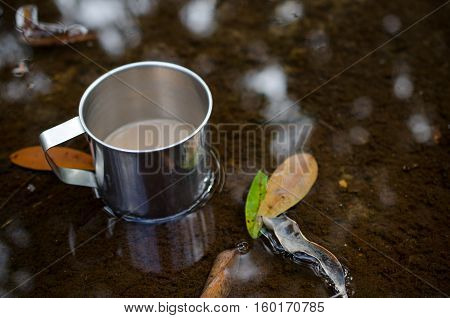 Place in a glass of hot coffee and cold clear streams. White sandals relaxing waterfront.