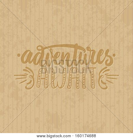 Adventures await - hand drawn lettering phrase isolated on the cardboard grunge background. Fun brush ink inscription for photo overlays, greeting card or t-shirt print, poster design.