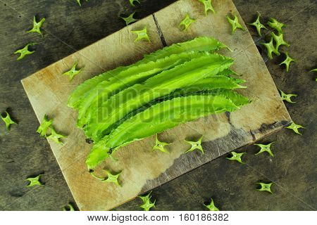 Winged beans on wooden background, Princess bean, Goa bean