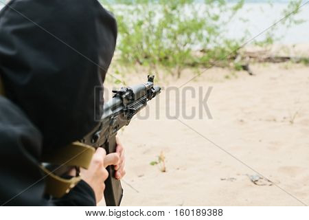 Armed man. criminal with a weapon. crime