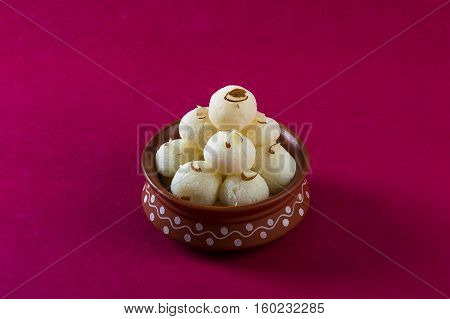 Indian Sweet or Dessert - Rasgulla, Famous Bengali sweet in clay bowl