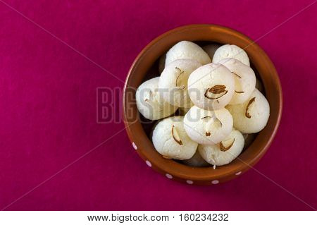 Indian Sweet or Dessert - Rasgulla, Famous Bengali sweet in clay bowl