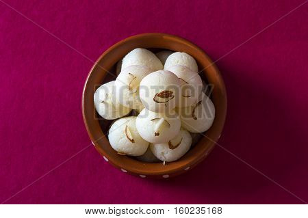 Indian Sweet or Dessert - Rasgulla, Famous Bengali sweet in clay bowl