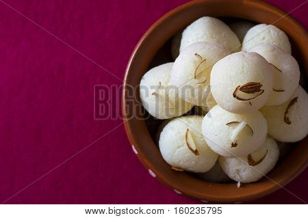 Indian Sweet or Dessert - Rasgulla, Famous Bengali sweet in clay bowl
