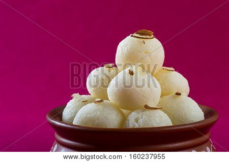 Indian Sweet or Dessert - Rasgulla, Famous Bengali sweet in clay bowl