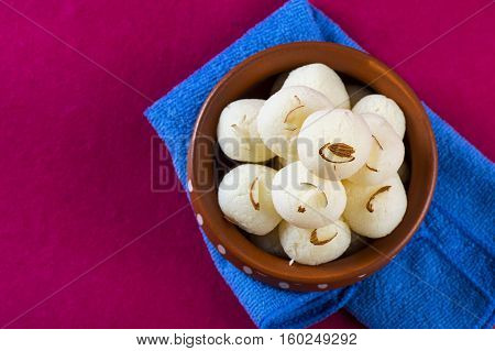 Indian Sweet or Dessert - Rasgulla, Famous Bengali sweet in clay bowl with napkin