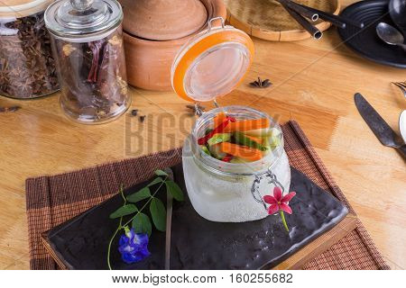 Dill Pickle Spears In Open Jar With Sandwich Ingredients.