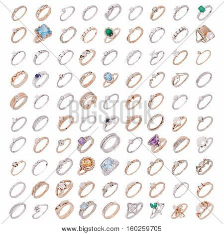 Hundred jewelry rings on a white background isolation