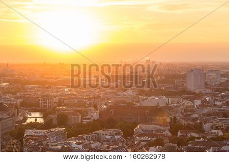 Beautiful panoramic aerial view over Berlin, Germany, in romantic colorful sunset.