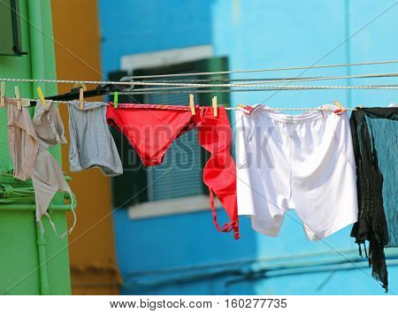 underwear for woman with bras and panties hanging in the sun