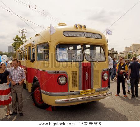 MOSCOW, RUSSIA - August 13, 2016: Citizens visiting the retro city bus of the 1950's ZIS 155. Festive occasion of the Moscow bus on the Frunze Embankment. August 13, 2016 in Moscow, Russia