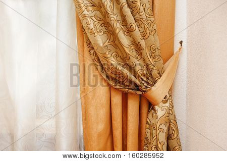 beautiful golden curtain in the bedroom near window