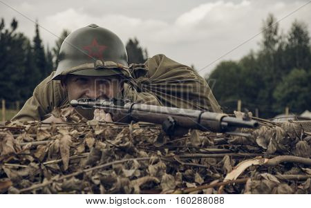 PERM RUSSIA - JULY 30 2016: Historical reenactment of World War II summer 1942. Soviet soldier with rifle