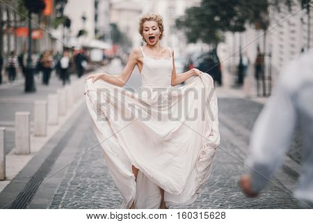 beautiful unique couple walks into your wedding day in Budapest