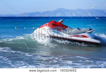 Jet Ski Moored inon on waves sea