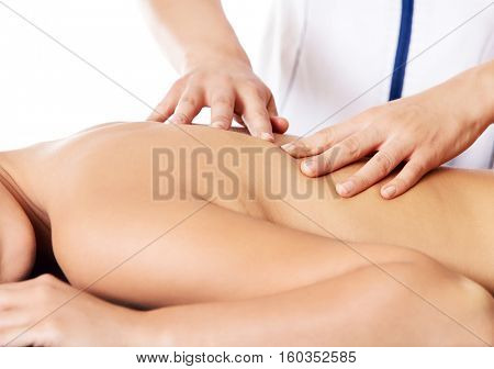Woman having massage of body in the spa salon. Beauty treatment concept.