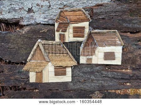 Three houses collage art.Made by wooden material