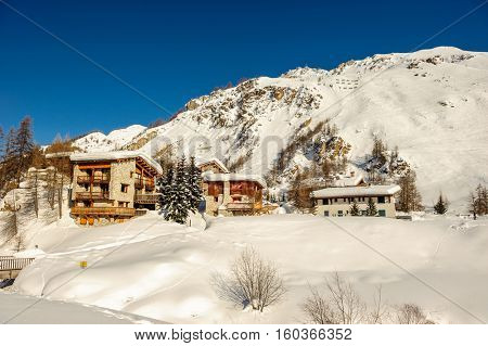 Alpine winter mountain landscape. French Alps covered with snow in sunny day. Val-d'Isere, France