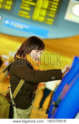 Girl Doing Self-checkin In The Airport