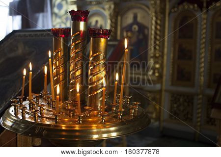 Candles in russian church near the altar