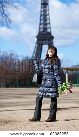 Positive And Happy Youg Tourist In Paris, Near The Eiffel Tower