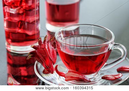 Cup Of Hibiscus Tea (karkade, Red Sorrel) On Table
