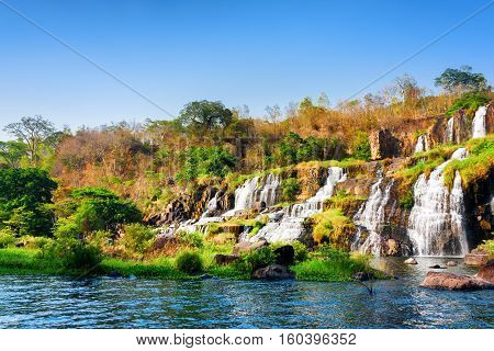 Beautiful View Of Natural Cascading Waterfall And Pool In Autumn