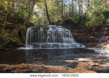 Rock River Falls is a beautiful waterfall located in the forest, Alger County, Michigan, USA