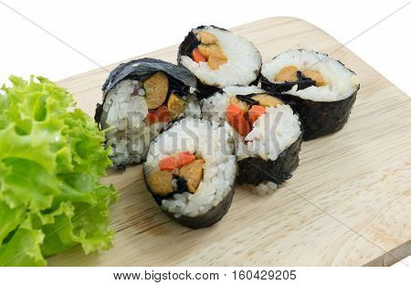 Japanese Cuisine Fresh Veggie Sushi Rolls or Vegetable Maki with Green Oak Served on Wooden Tray.