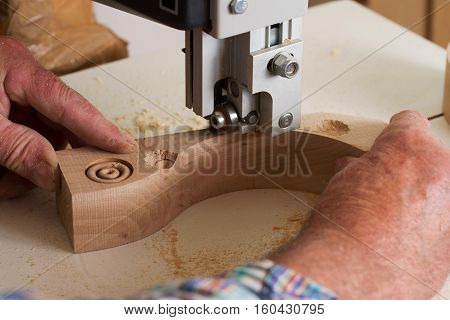 Carpenter tools on wooden table with sawdust. Circular Saw. Carpenter workplace top view.
