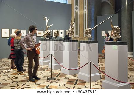 St Petersburg, Russia, Dec 1, 2016: People look at the self-portraits of artist. Exhibit of temporary modern art exhibition 