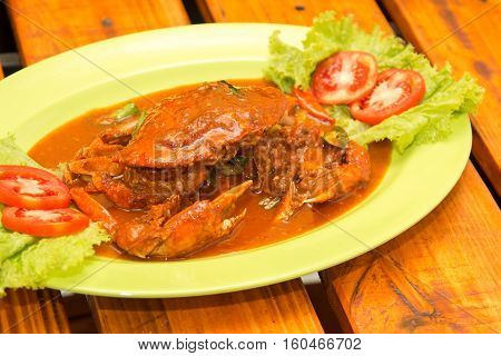 Special fried crab with Padang chili sauce with tomatoes slice and lettuce
