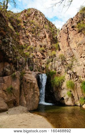 Long shot of a waterfall on the Cascadas del rio Colorado Trek close to Cafayate in Argentina South America