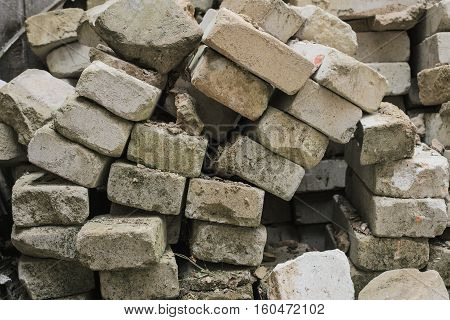 bricks from the destroyed house earthquake. destroyed building