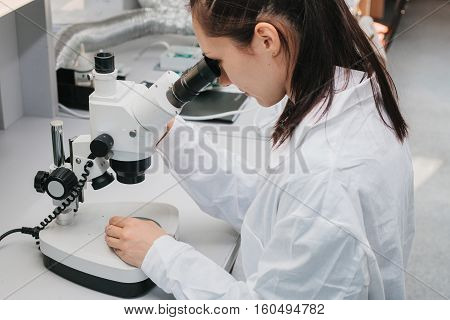 Microchip production factory. Technological process. Assembling the board. Chip. Professional. Technician. Computer expert. Manufacturing. Engineering.