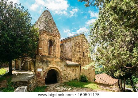 Mtskheta, Georgia. The Church Of St. John The Baptist, The Earliest Stone Building Of Shio-Mgvime Monastery, Medieval Monastic Complex With Carved Caves In Sunny Spring.