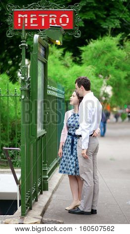 Beautiful Couple Near The Metro Station In Paris