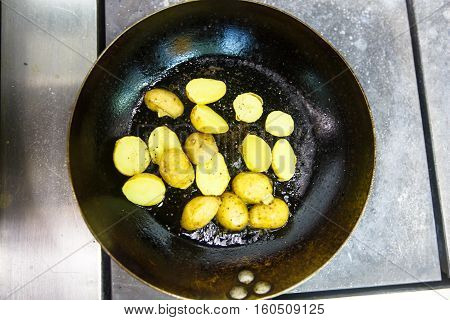 Bebbi-potatoes Fried In A Pan In The Restaurant.
